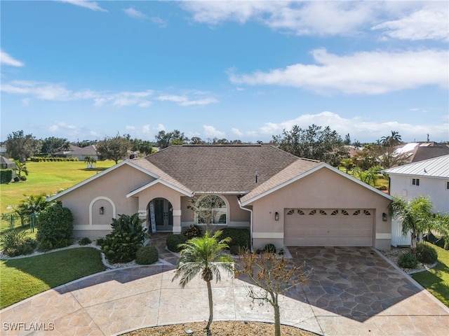 single story home with a garage and french doors