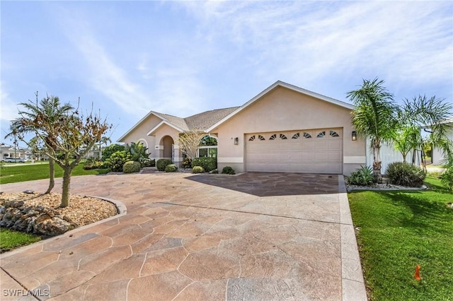 7417 S Blue Sage, Punta Gorda, FL 33955 - single story home featuring stucco siding, an attached garage, concrete driveway, and a front lawn