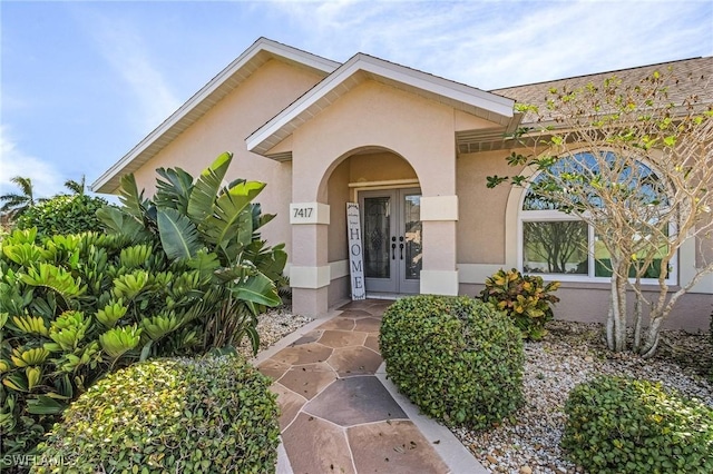 7417 S Blue Sage, Punta Gorda, FL 33955 - property entrance with french doors and stucco siding