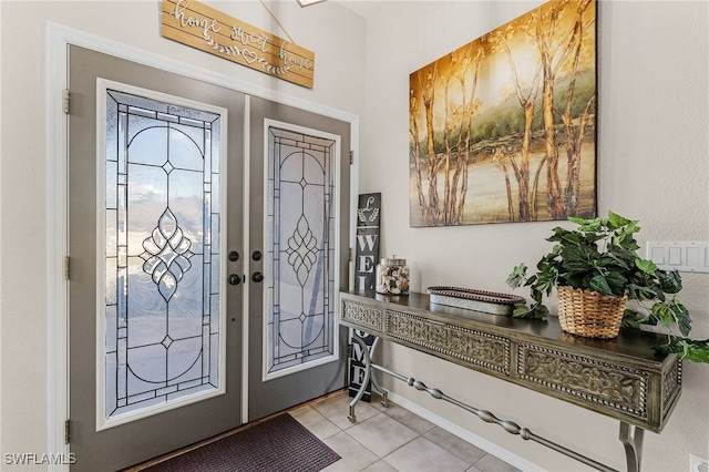 tiled entryway with french doors