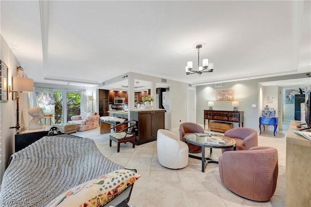 living room with a chandelier and light tile patterned flooring