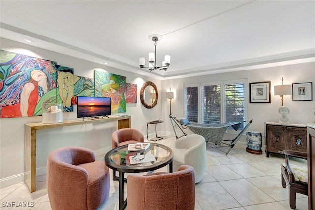 interior space featuring an inviting chandelier and a raised ceiling