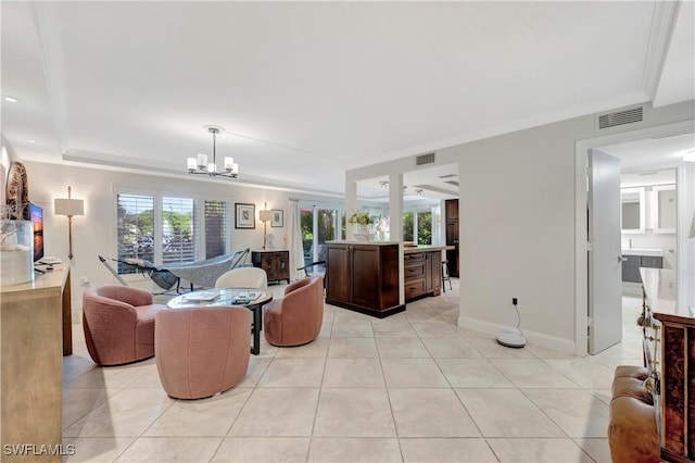 living room with an inviting chandelier, light tile patterned floors, and ornamental molding