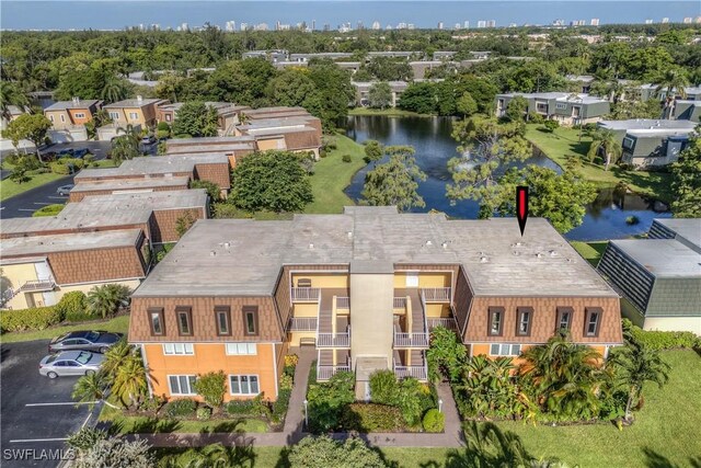 birds eye view of property with a water view