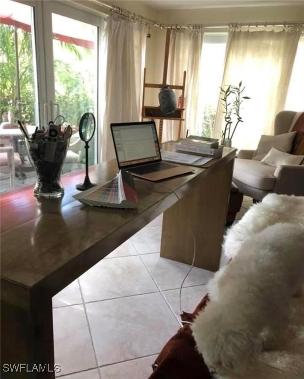 tiled dining room with a wealth of natural light