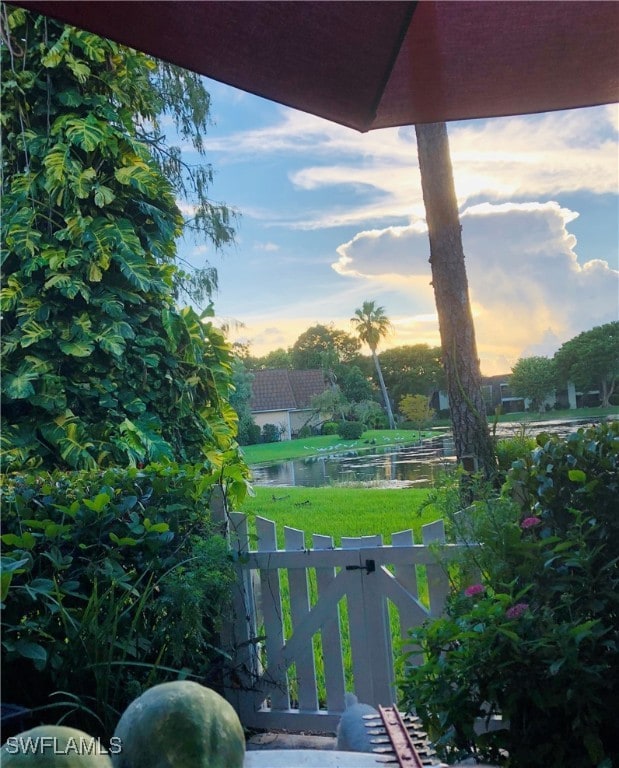 yard at dusk with a water view