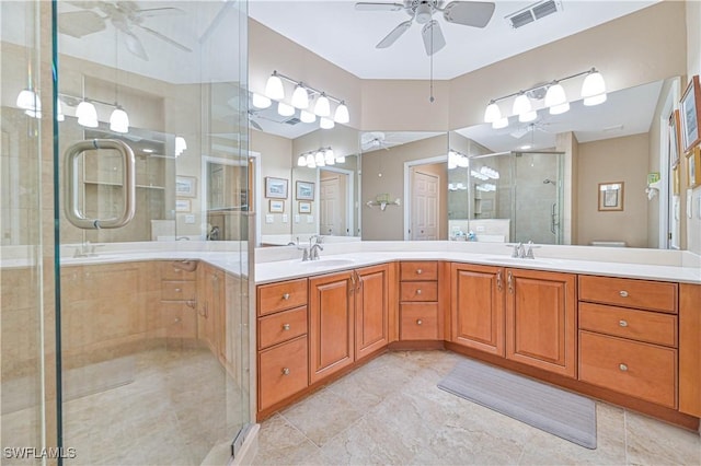 bathroom with tile patterned floors, ceiling fan, vanity, and a shower with shower door