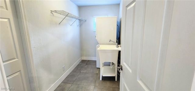 laundry room with light tile patterned floors