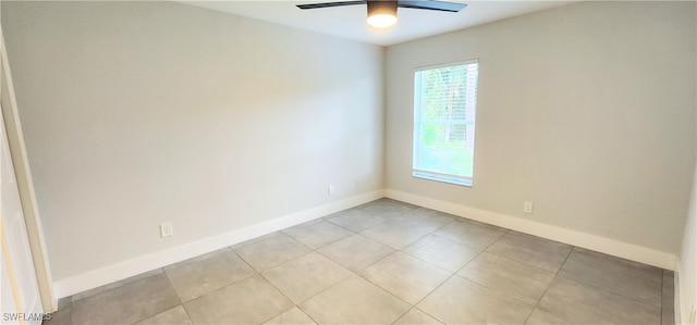 unfurnished room with light tile patterned floors and ceiling fan