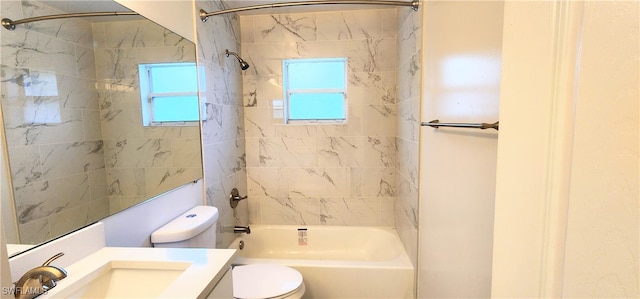 full bathroom with tiled shower / bath combo, toilet, and vanity