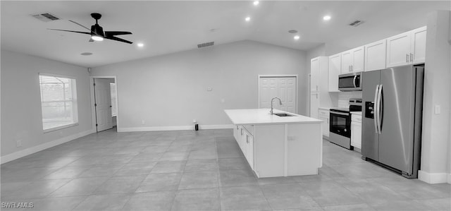 kitchen featuring ceiling fan, sink, a center island with sink, white cabinets, and appliances with stainless steel finishes