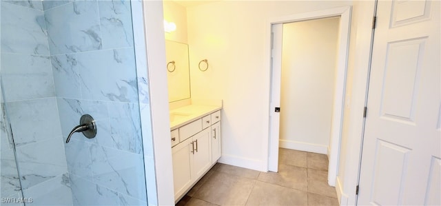 bathroom featuring tile patterned flooring and vanity