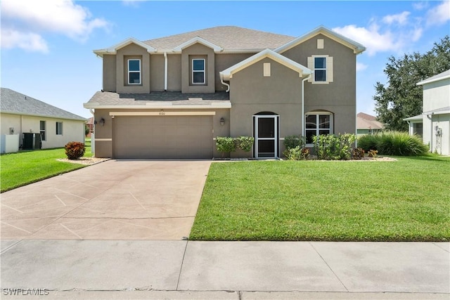 view of front of property with a front yard, central AC, and a garage