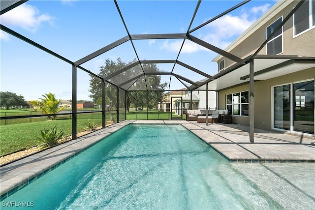 view of pool with glass enclosure, a patio area, an outdoor living space, and a lawn