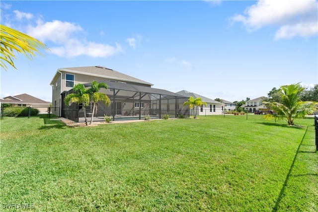 view of yard with glass enclosure