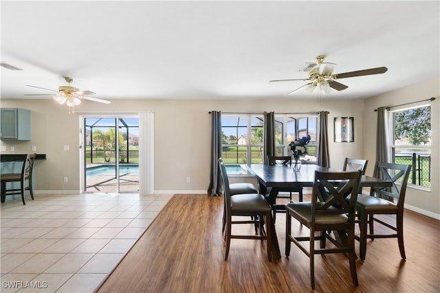 dining room featuring ceiling fan and light tile patterned floors