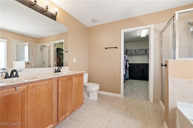 full bathroom featuring independent shower and bath, toilet, tile patterned floors, and vanity