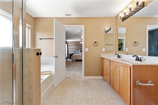 bathroom with vanity, a washtub, ceiling fan, and tile patterned flooring