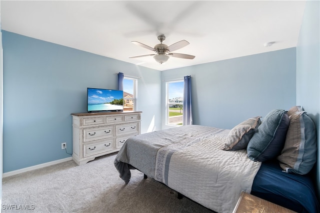 bedroom featuring ceiling fan and light carpet