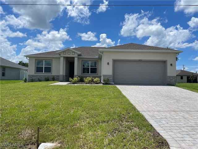 ranch-style home with a front yard and a garage