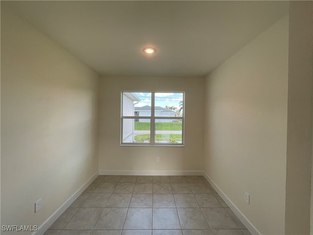 empty room with light tile patterned flooring