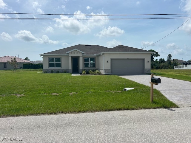 single story home with a front lawn and a garage