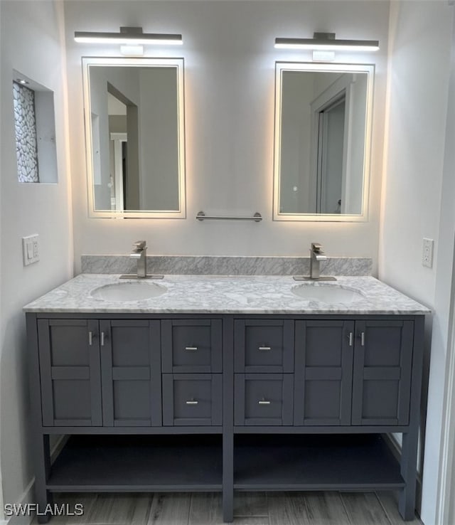 bathroom with vanity and hardwood / wood-style flooring