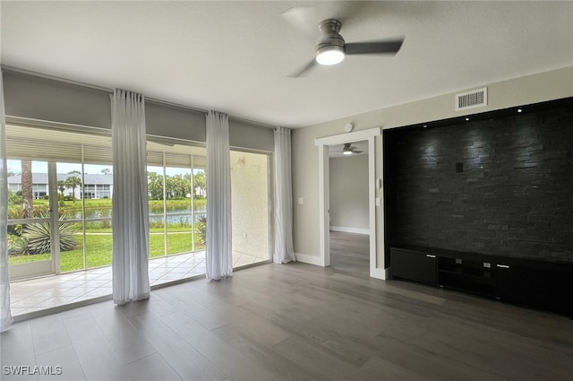 spare room featuring ceiling fan and hardwood / wood-style floors