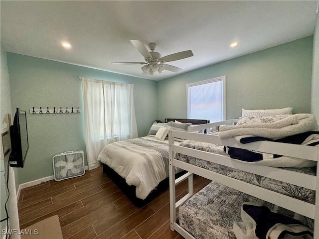 159 Pearl St, Fort Myers Beach, FL 33931 - bedroom featuring dark wood finished floors, ceiling fan, baseboards, and multiple windows