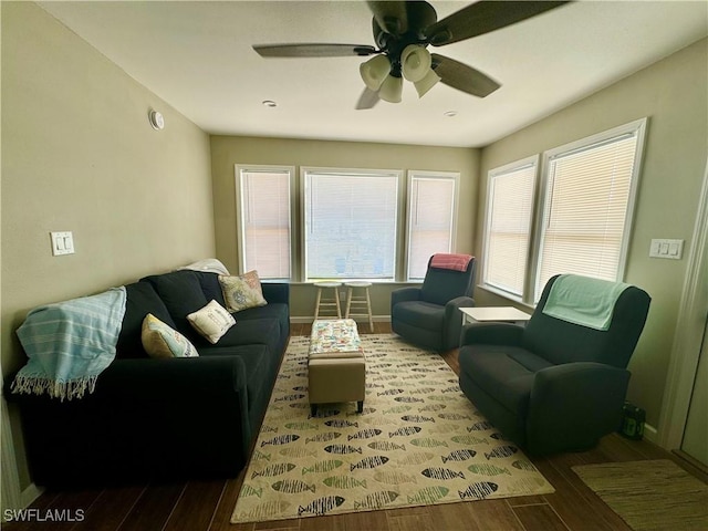 159 Pearl St, Fort Myers Beach, FL 33931 - living room with wood finished floors, baseboards, and a ceiling fan