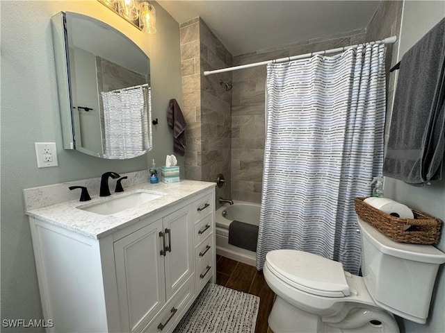 159 Pearl St, Fort Myers Beach, FL 33931 - full bath with toilet, shower / bathtub combination with curtain, vanity, and wood finished floors