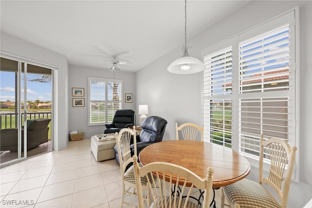 tiled dining area with ceiling fan