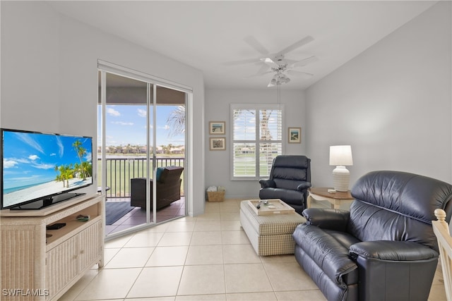 tiled living room featuring ceiling fan