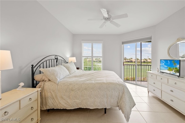 tiled bedroom featuring access to exterior, multiple windows, and ceiling fan