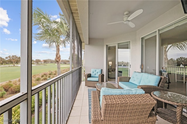 balcony featuring ceiling fan and an outdoor living space