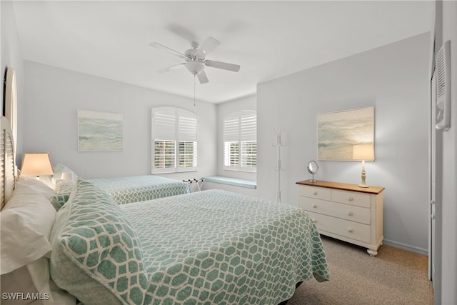 bedroom with light colored carpet and ceiling fan