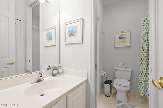 bathroom featuring vanity, toilet, and tile patterned flooring