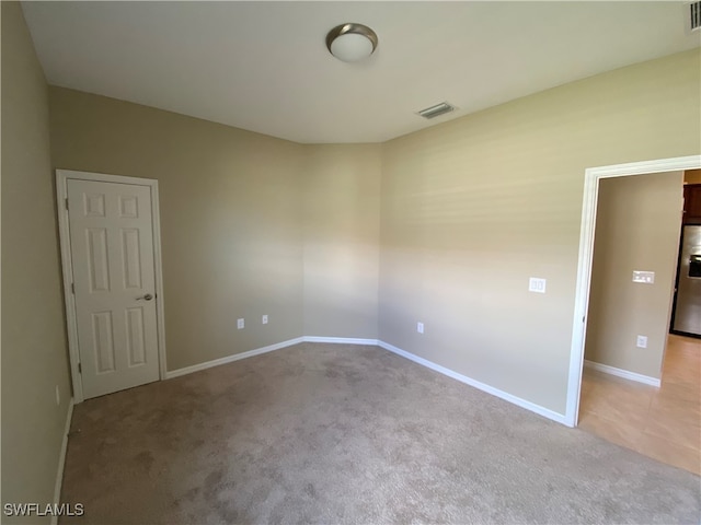 view of carpeted spare room