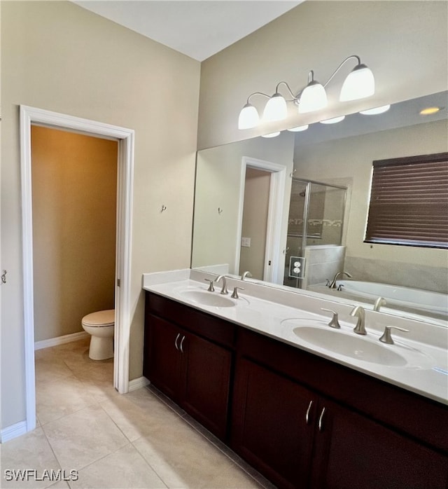 full bathroom featuring tile patterned flooring, vanity, toilet, and independent shower and bath