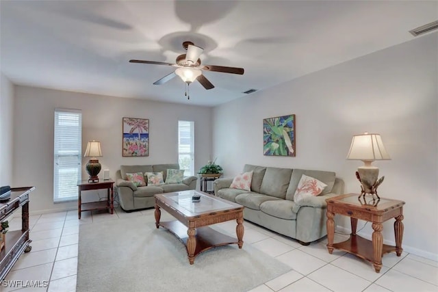 living room featuring ceiling fan and light tile patterned floors