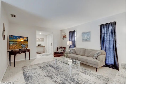 living room featuring light tile patterned floors