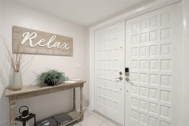 foyer with light tile patterned floors