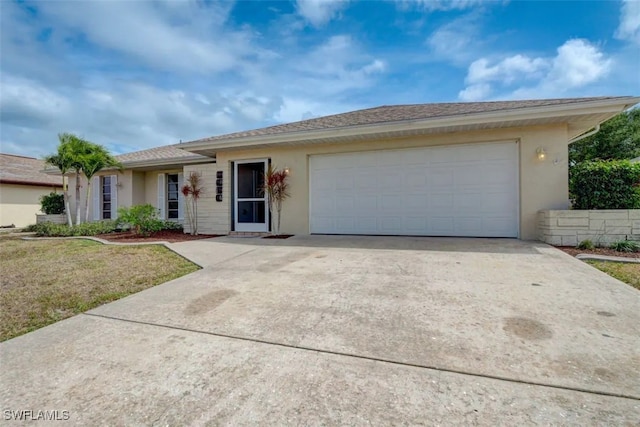 ranch-style home featuring a front yard and a garage