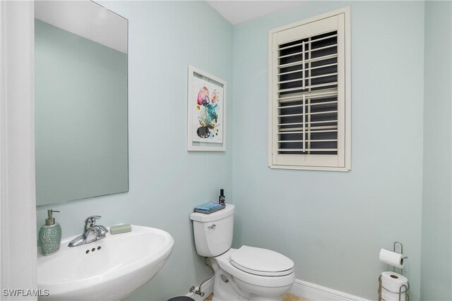 bathroom with sink and toilet