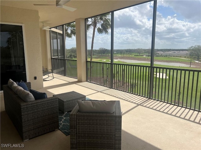 sunroom with a water view and a healthy amount of sunlight