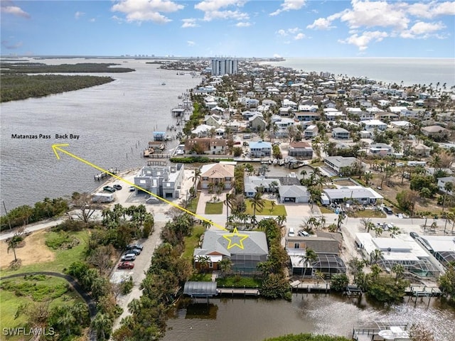 drone / aerial view with a water view