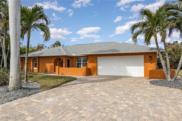 single story home with a garage