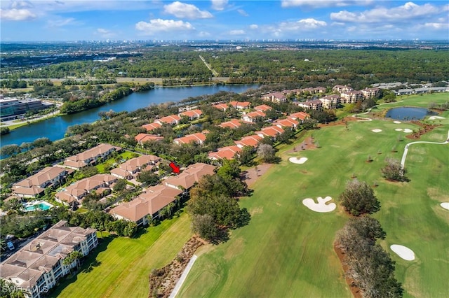 birds eye view of property featuring view of golf course, a water view, and a residential view