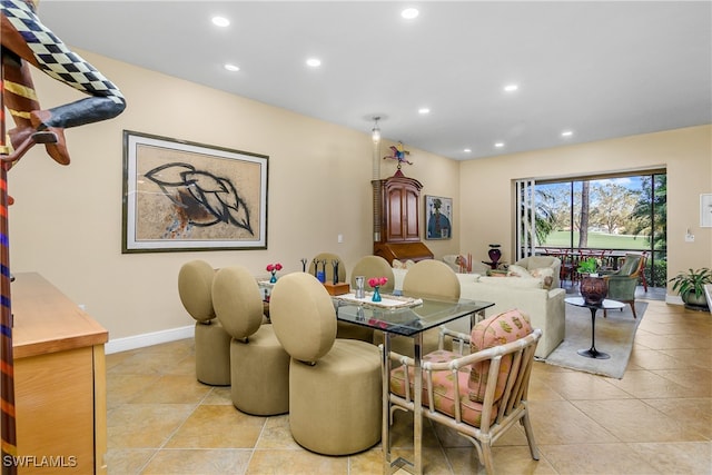 dining room featuring light tile patterned floors, baseboards, and recessed lighting