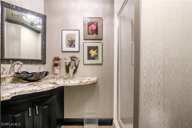 bathroom featuring a stall shower and vanity